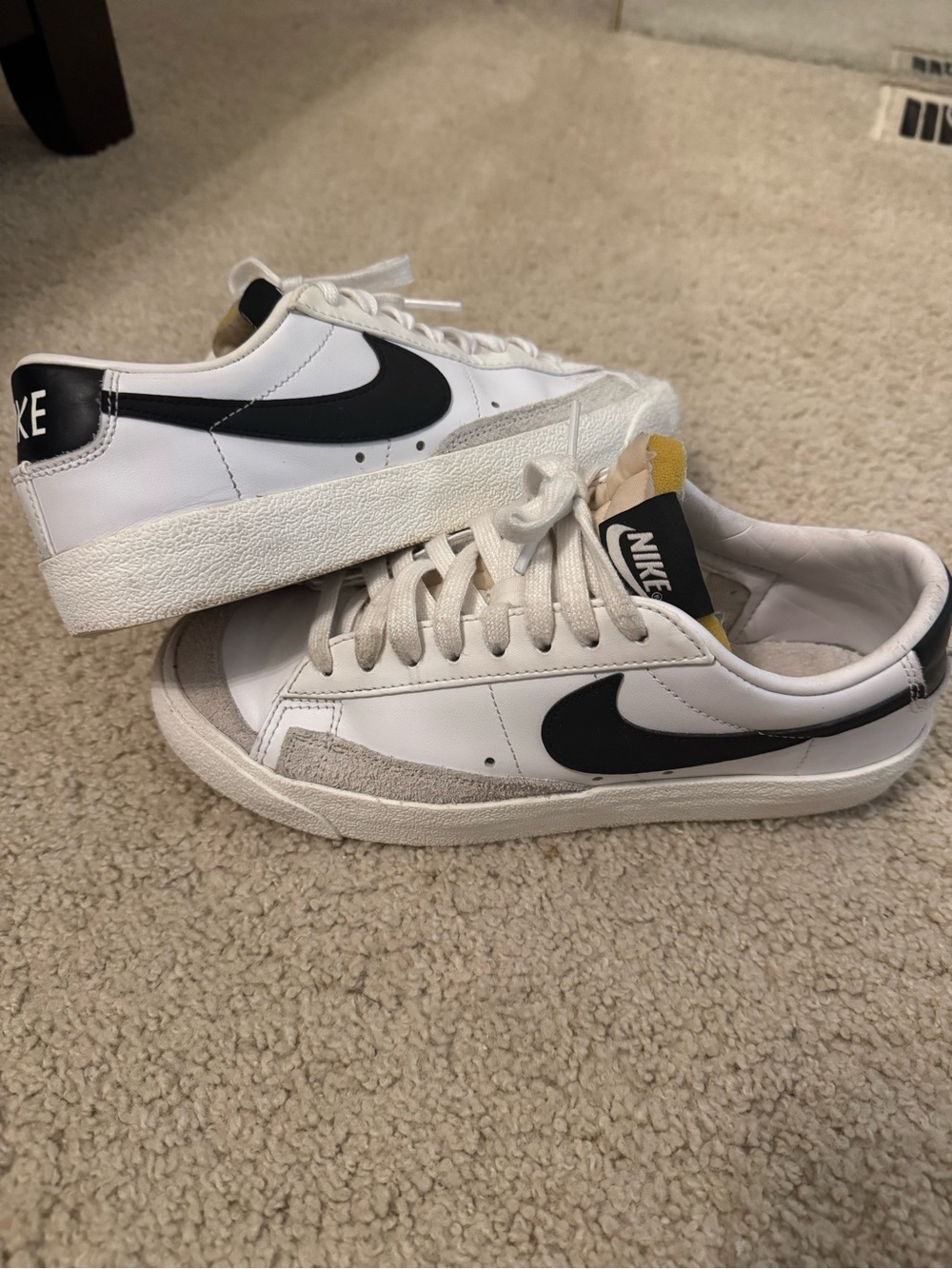 Nike Men’s White Leather Sneakers with Black Swoosh and Yellow Tongue Tab